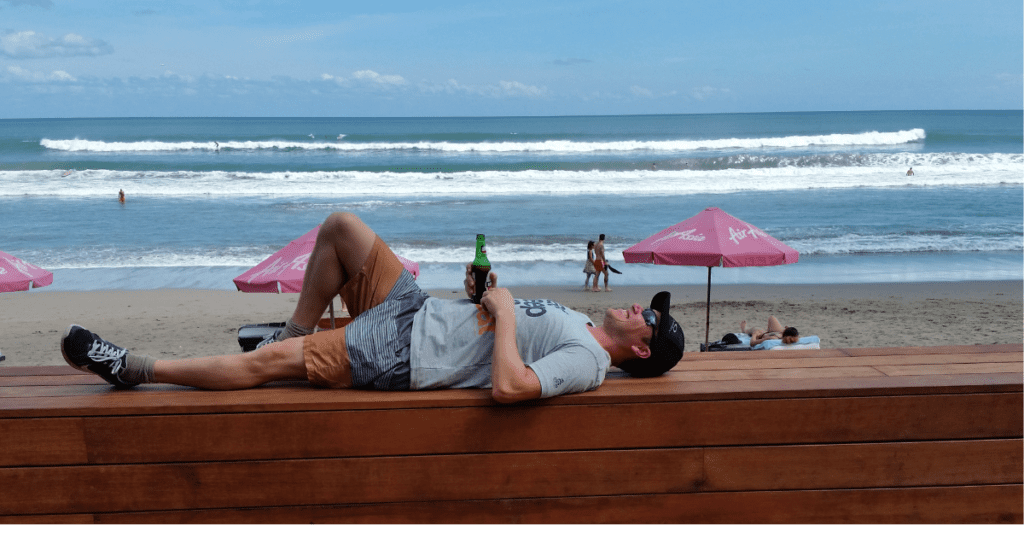 Man lying on bench in bali